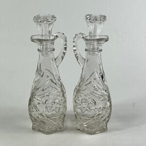 Vintage Pressed Glass Cruet Set with Stoppers Star Pattern Clear 7.5" Tall Pair